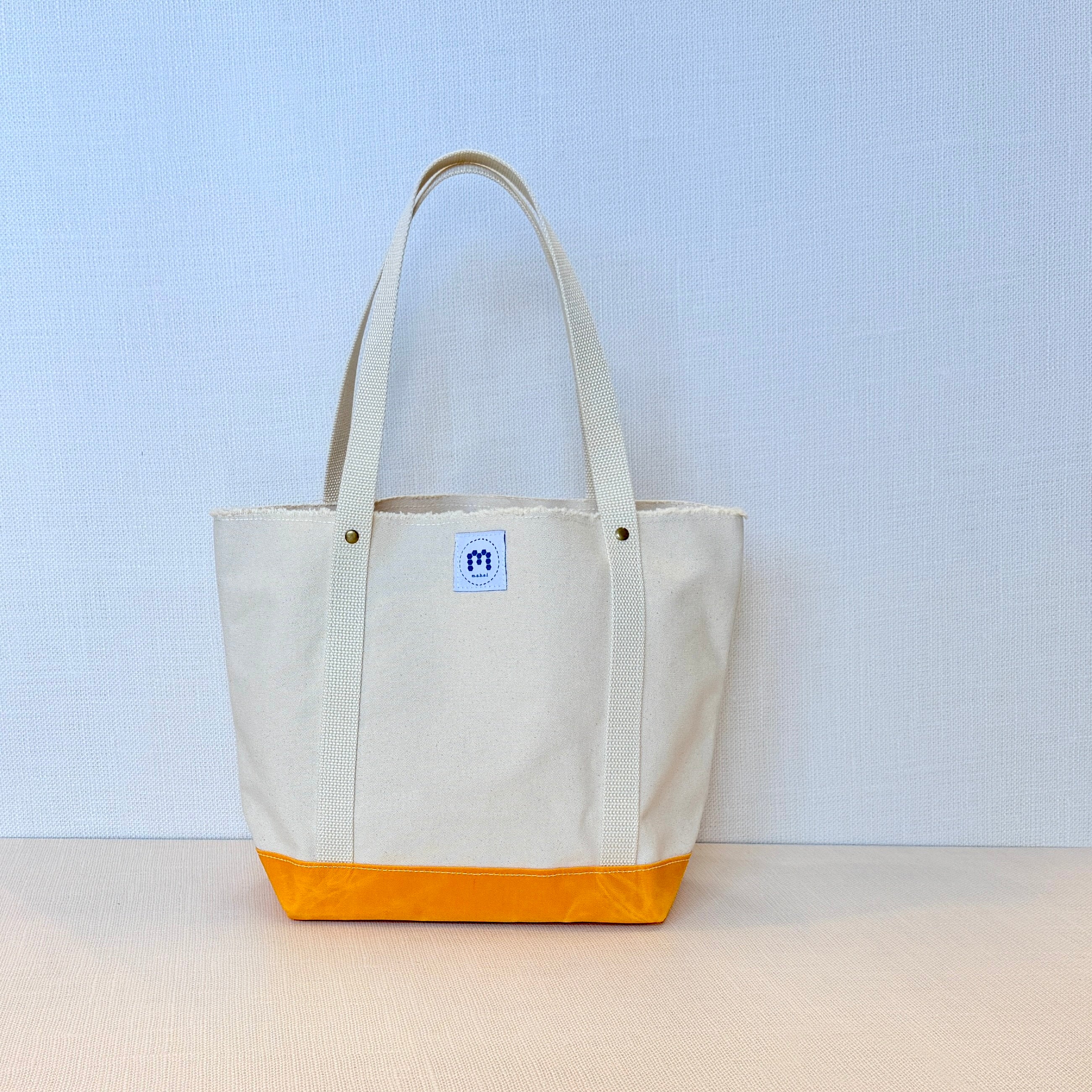 The Skipper Pocket Tote (Yellow/Orange Canvas with Faded Floral Kitten)