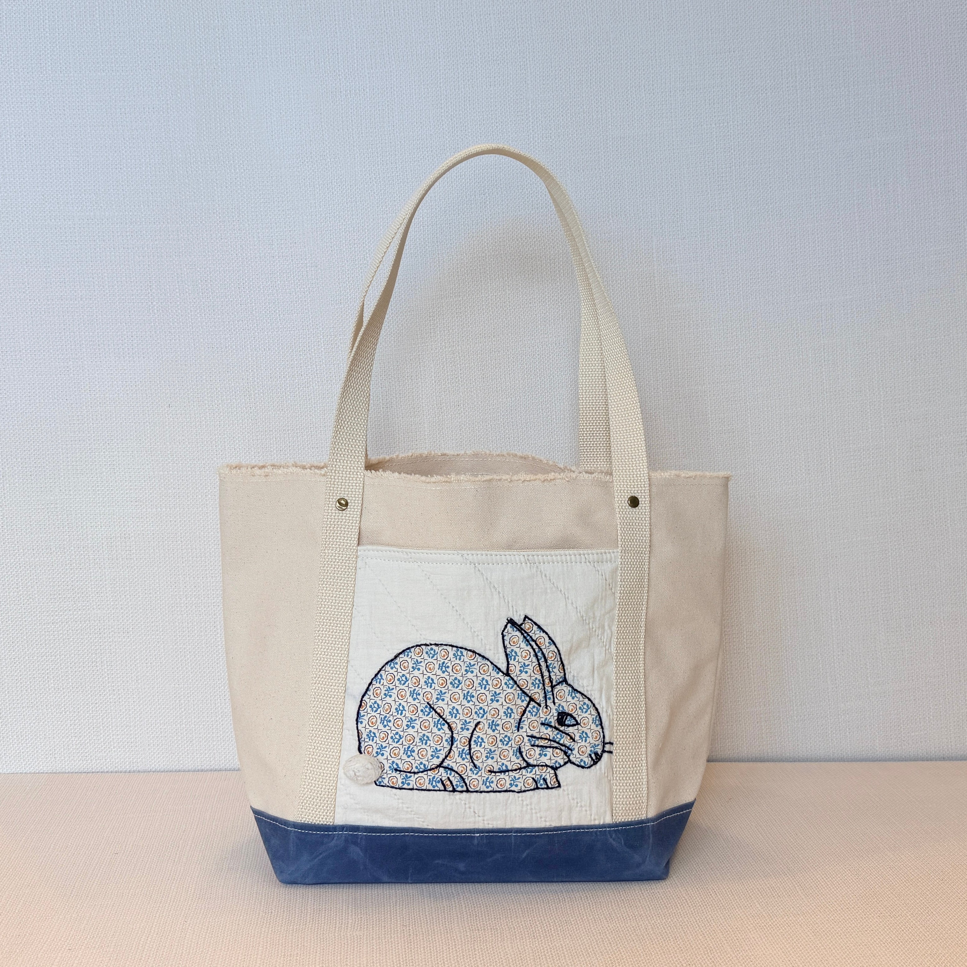 The Skipper Pocket Tote (Blue Canvas Bunny)