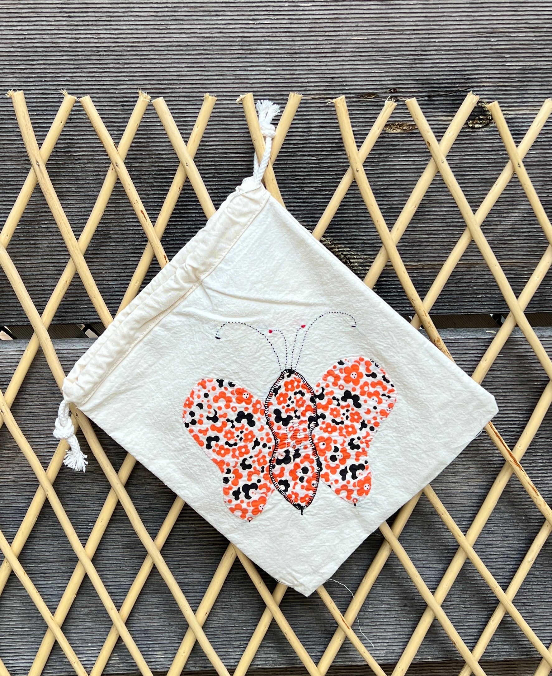 4 Antennae Butterfly Drawstring Bag (Black Swirls & Orange Daisies)